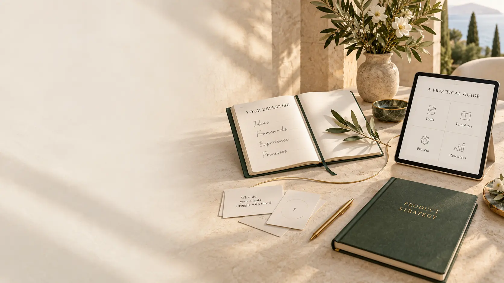 An elegant strategy desk overlooking the Mediterranean, with a notebook, planning cards and digital product tools